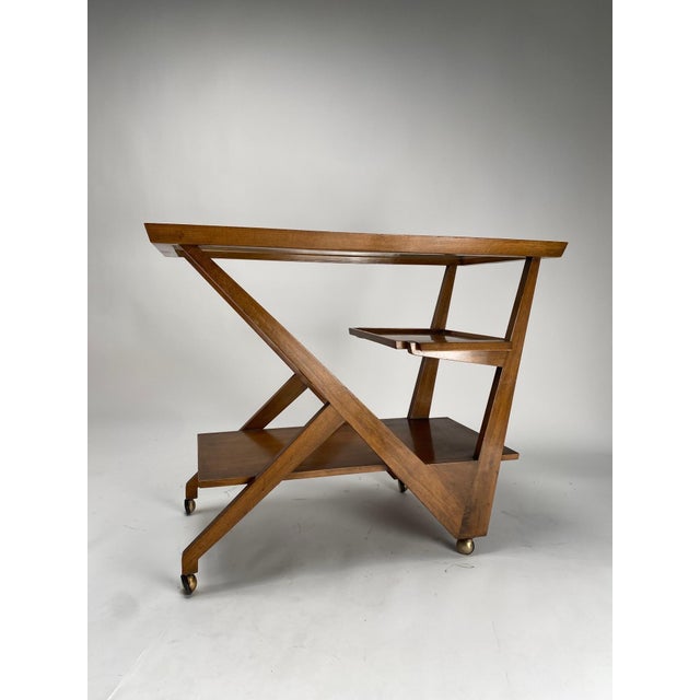 Important Mid-Century trolley in wood, glass and brass, with complex geometric articulations, from a villa in Bolgna...