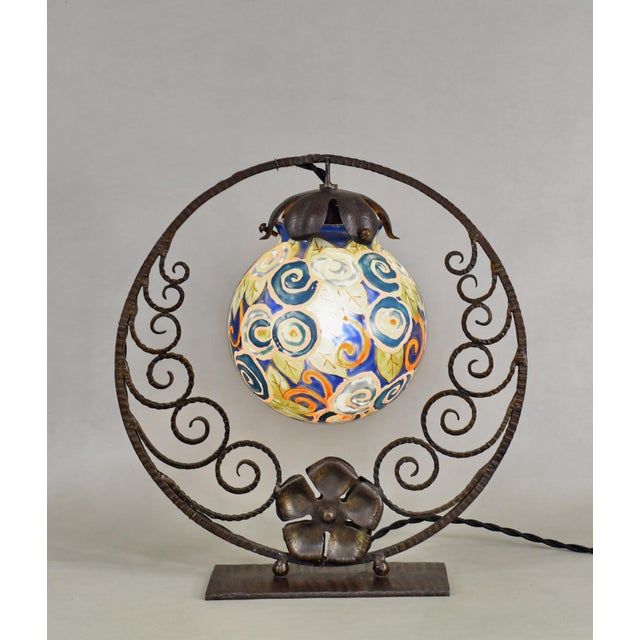 Adrien Mazoyer A wonderful French art deco lamp made around 1925-1930. A wrought iron base holds a nice enameled ball...