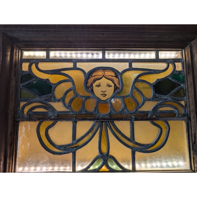 Gorgeous stained glass piece with original leading, jewels and a Victorian angel atop. This piece is truly one-of-a-kind...