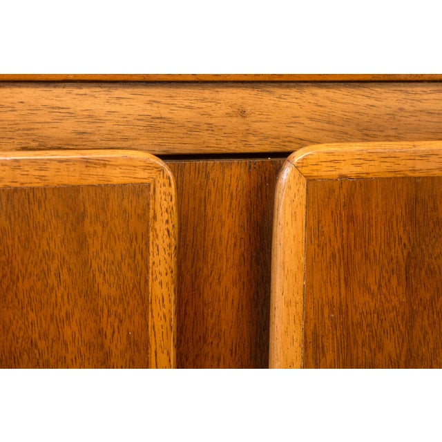 A vintage Kent Coffey Insignia highboy dresser. This gorgeous mid-century modern highboy dresser features a stunning...