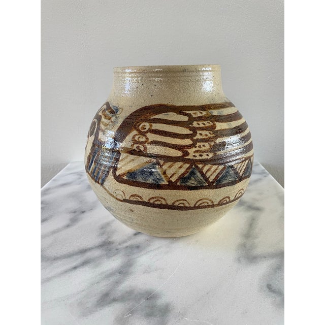 A signed vintage stoneware pot with a dragon or serpent motif. The origin is unknown but it has great form and rustic hand...