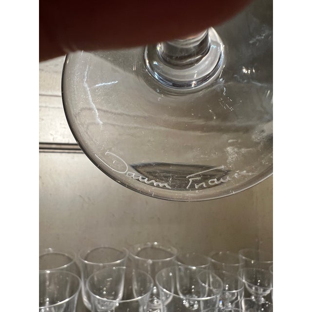 This expansive collection of Daum France crystal stemware, specifically the elegant Orval model, represents the pinnacle...
