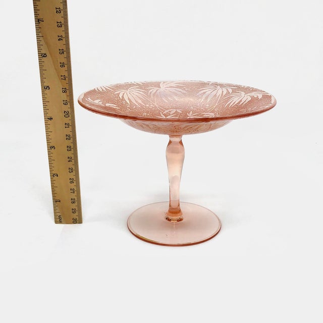 This Fostoria iridescent pink glass brocade palm compote is in good condition as pictured with no chips or cracks. Most of...