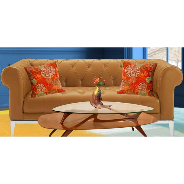 This striking 11-inch mid-century sculpture captures a koi fish in a graceful arc, frozen in a moment of poised motion....