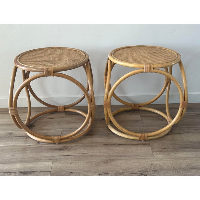 A stylish pair of vintage bentwood side tables featuring sculptural circular loop bases and woven rattan tops. Inspired by...