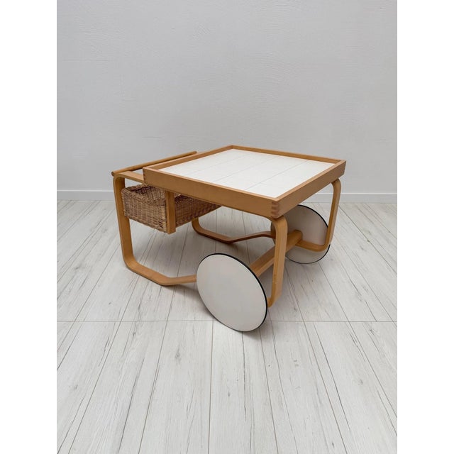 Iconic model 900 tea trolley, designed by alvar aalto for artek finland. the trolley features aalto’s characteristic bent...