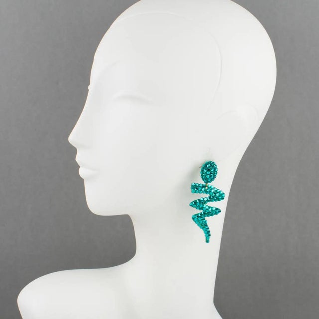 Richard Kerr designed these elegant pierced earrings in the 1980s. They are made up of his signature paved crystal...