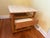 A sophisticated 1960s side table designed by celebrated American furniture designer Harvey Probber, featuring a...