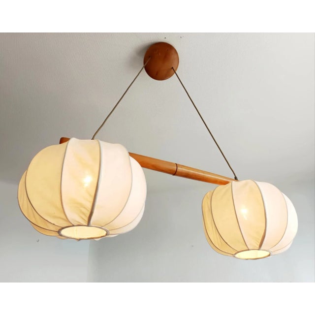 Vintage Scandinavian-style pendant light, circa 1980 Pendant light composed of a horizontal piece of light wood to which...