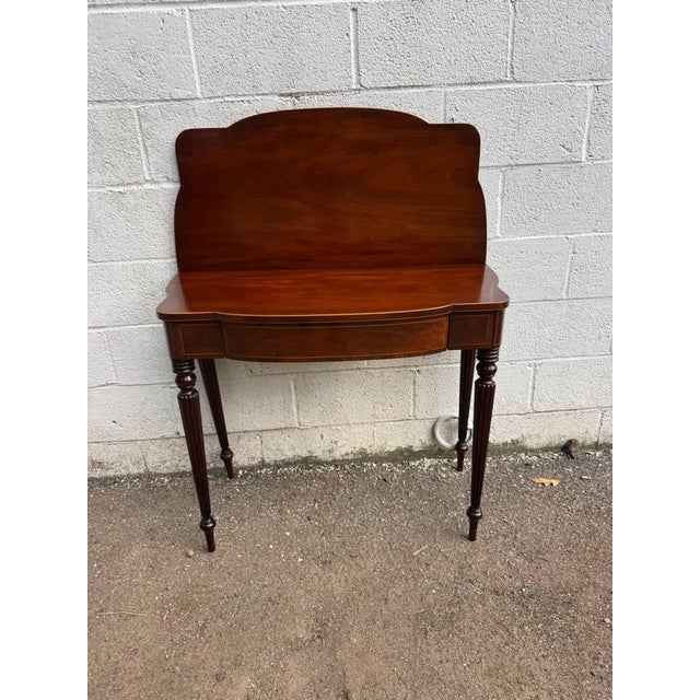 Antique Federal Style Mahogany Fold Top Card Game Table. It serves as a console table when not in use, The top folds out...