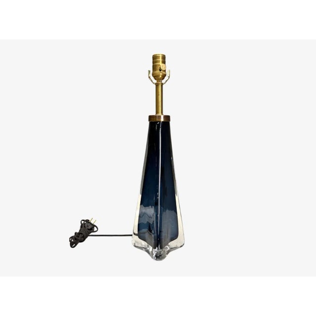 Nils Landberg, Orrefors, Swedish Modern, Blue Glass, Table Lamp, Sweden, 1960s A deep blue glass and brass table table...