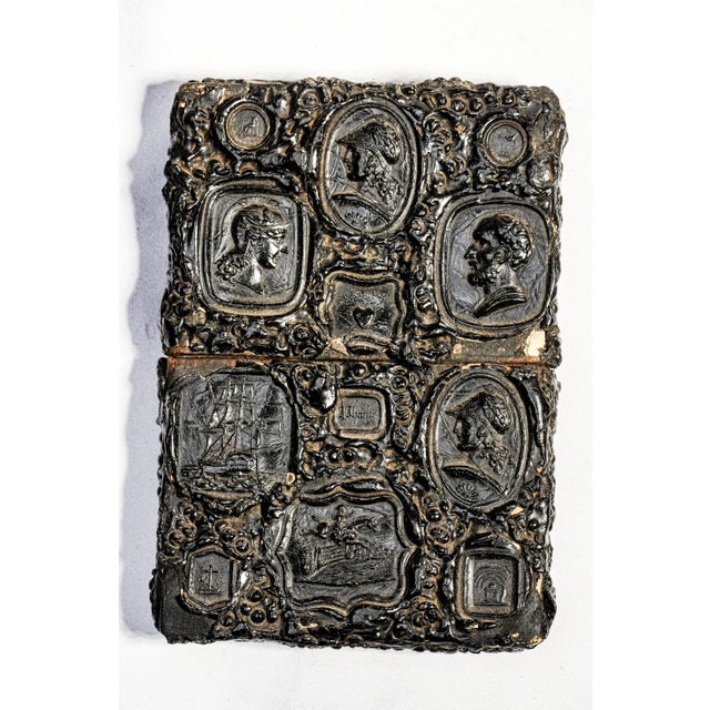 An exceptional example of Victorian craftsmanship, this antique calling card case is fashioned from richly molded gutta-...