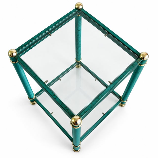 Charming vintage two-tier side table dating from around the 1980s. The metal frame features a striking turquoise faux-...
