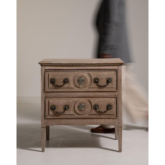 A distinguished example of 19th-century French provincial craftsmanship, this substantial chest of drawers is fashioned...