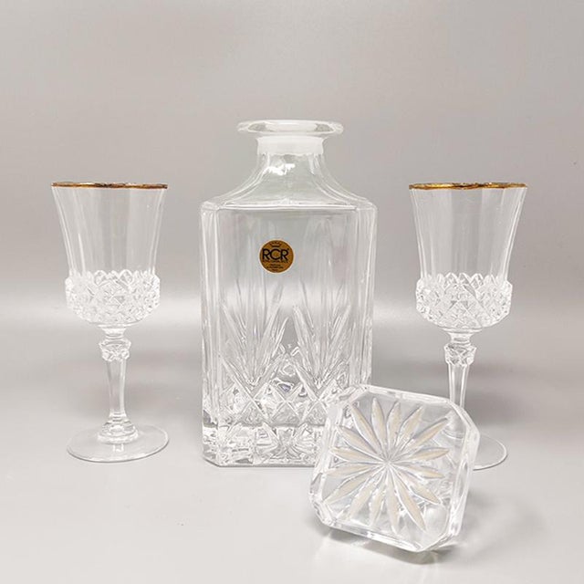 1970s gorgeous crystal decanter by rcr with 2 crystal glasses. Made in italy the items are in excellent condition....
