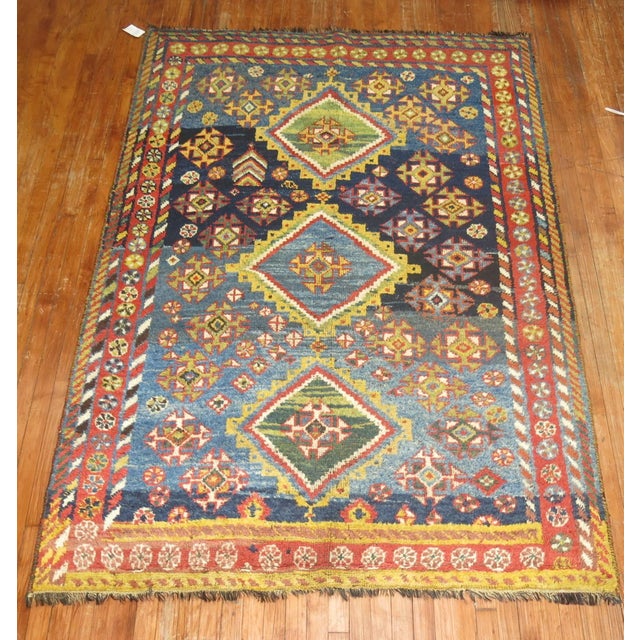 A colorful one of a kind antique Persian Gabbeh rug from the 2nd quarter of the 20th century. Measures: 5'5'' x 7'7''....