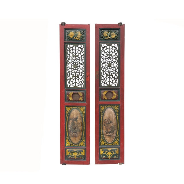 Pair of Vintage Red, Green, and Yellow Fujian-Style Door Panels featuring bold relief carvings and intricate see-through...
