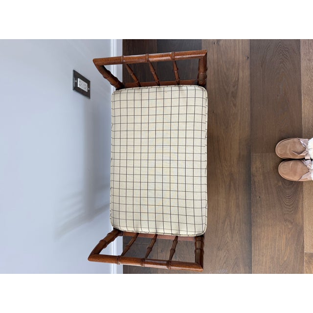 This elegant vintage bench by Baker Furniture features a solid wood frame with beautifully turned legs and spindle-style...