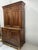 Two-part louis philippe style buffet in solid walnut lower section with two framed doors upper section with three interior...