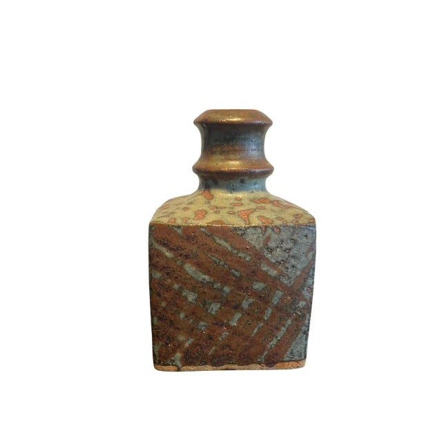 A striking Japanese studio pottery bottle vase, likely from the mid-20th century, showcasing masterful craftsmanship and a...