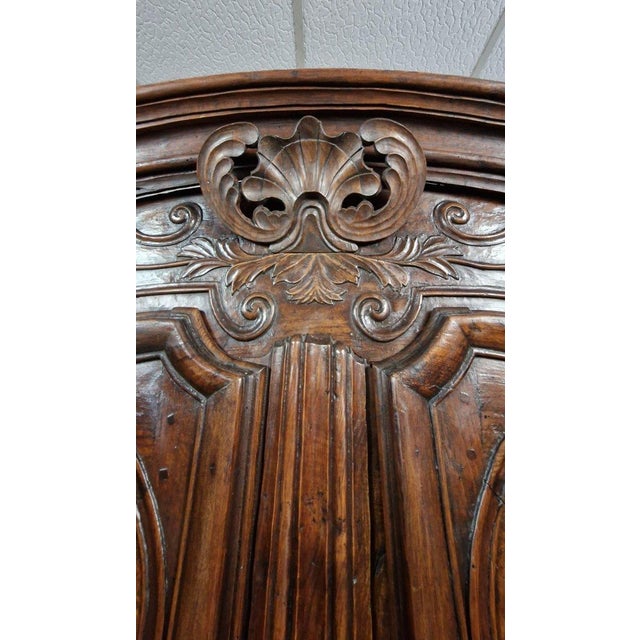 Louis xv period armoire in elm and walnut marquetry, crafted by master antoine sertelon in 1773. this cabinetmaking gem...