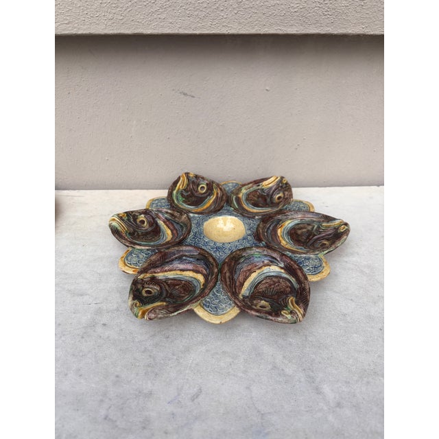 Rare Majolica Palissy oyster plate attributed to Thomas Sergent with fishs heads, circa 1880.