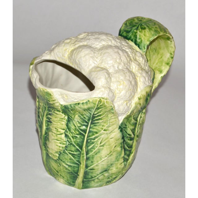 The Lord & Taylor Cauliflower Pitcher is a classic example of Italian majolica pottery from the mid‑20th century, produced...