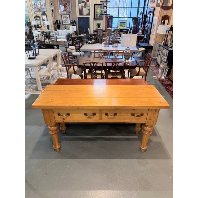 A beautifully proportioned Country English farmhouse console table crafted in warm natural pine. The substantial plank...