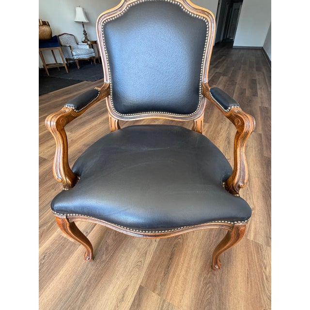 Vintage 1989 Château d’Ax Italian Louis XV Style Black Leather Armchair Beautiful vintage Italian armchair manufactured by...