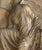 A beautiful large-scale antique plaster relief depicting Nike, the Greek goddess of victory, adjusting her sandal....