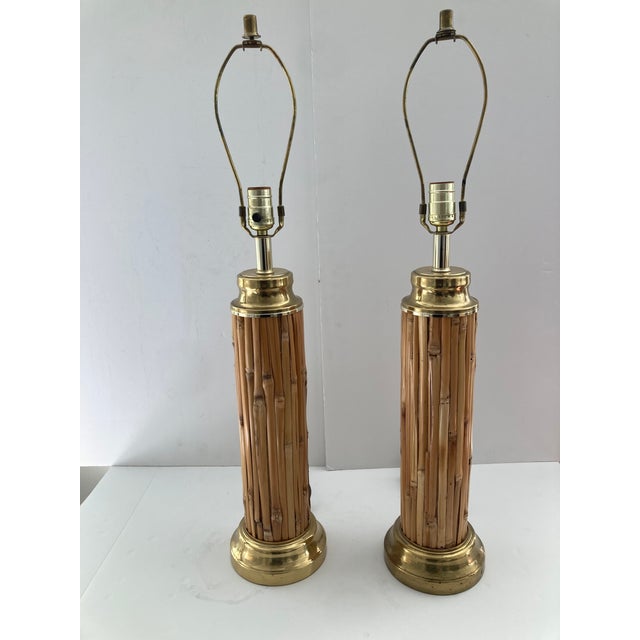 Very unusual Pair of Pencil Reed Rattan Table Lamps with Brass details . Nice height and quality , just add your favorite...