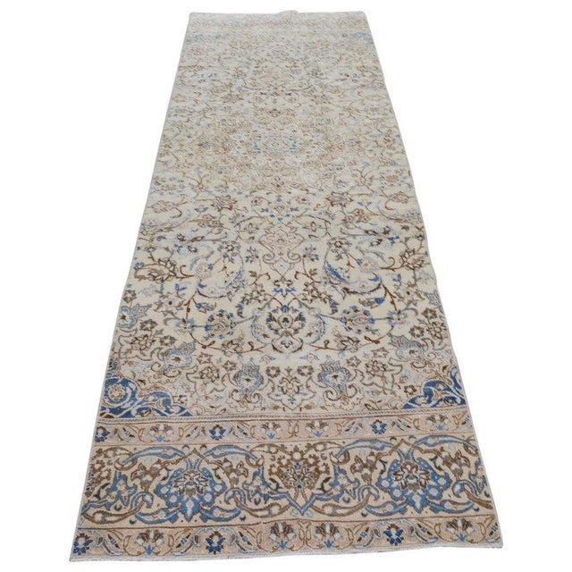 Hand-knotted with care using traditional rug-making techniques, this wool rug blends timeless craftsmanship with a modern...