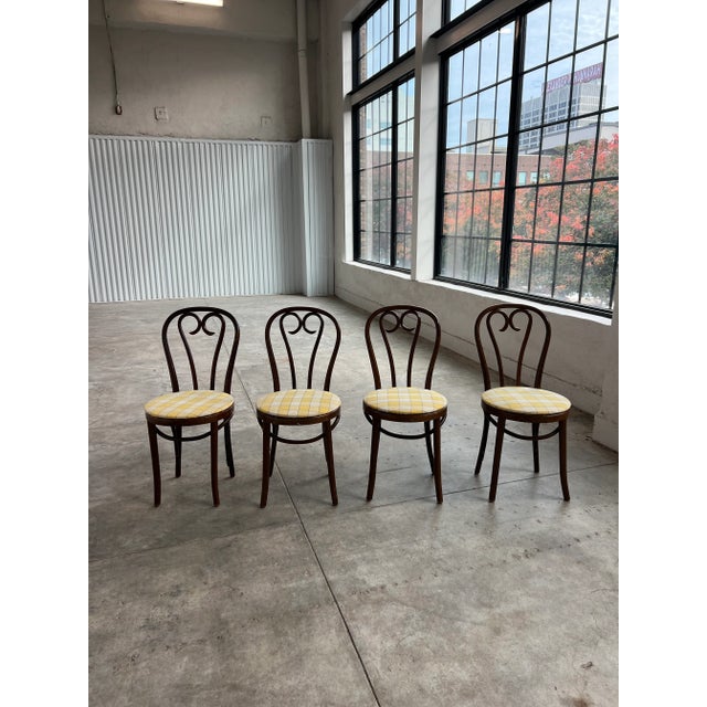 1960’s wooden bistro bentwood dining chairs. The chairs are sturdy and have a label dating back to mid 20th Century (see...