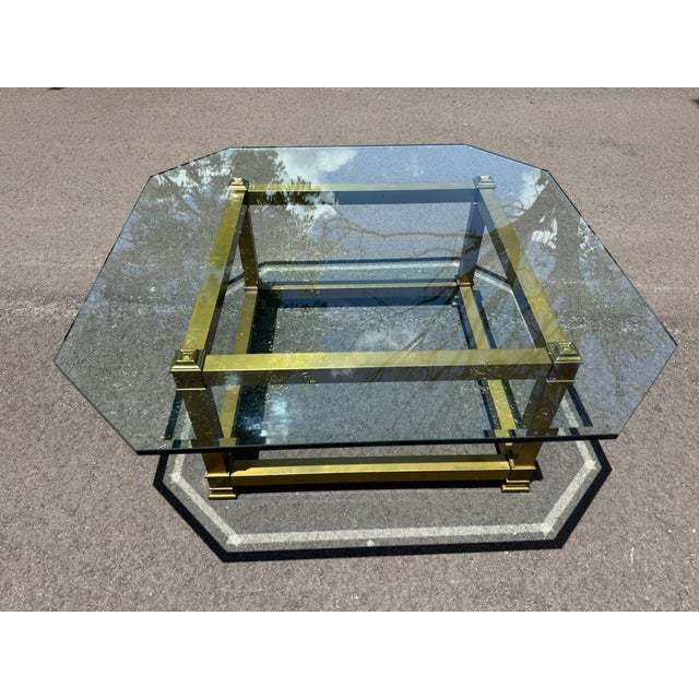 Fine brass profile base 3/4” thick chamfered edge glass top coffee table with square cut corners, manufactured in Italy...