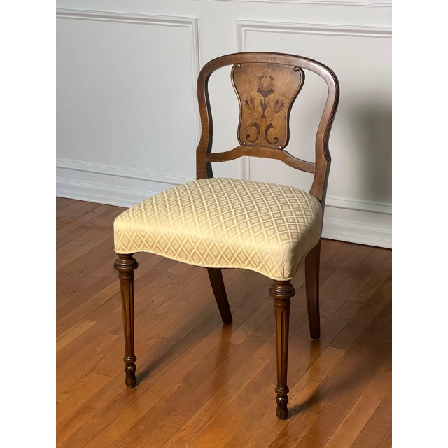 French inlaid walnut boudoir, vanity chair in the Louis XVI manner, early 1900s. A gracefully formed chair with a shaped...