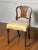 French inlaid walnut boudoir, vanity chair in the Louis XVI manner, early 1900s. A gracefully formed chair with a shaped...