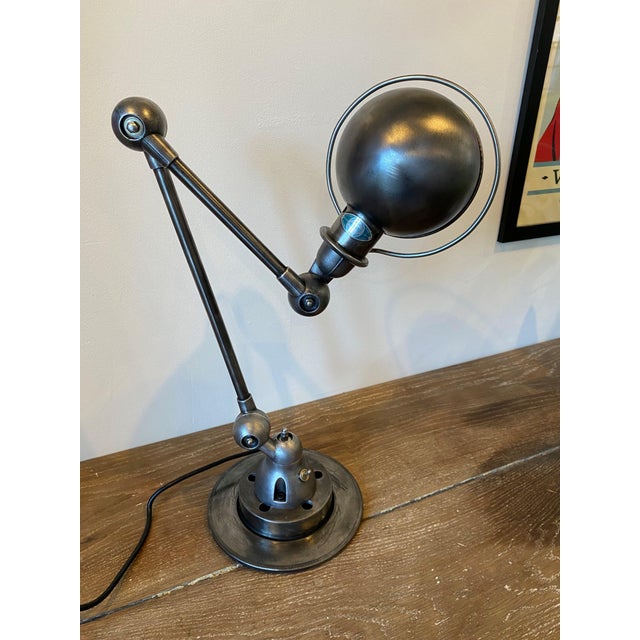 Authentic vintage Jieldé table/desk lamp with a 40cm arm and a 25cm arm. The lamp has been completely stripped, brushed,...