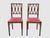 Crafted in solid wood with fine geometric inlay typical of early 20th-century German Jugendstil design. The chairs reflect...