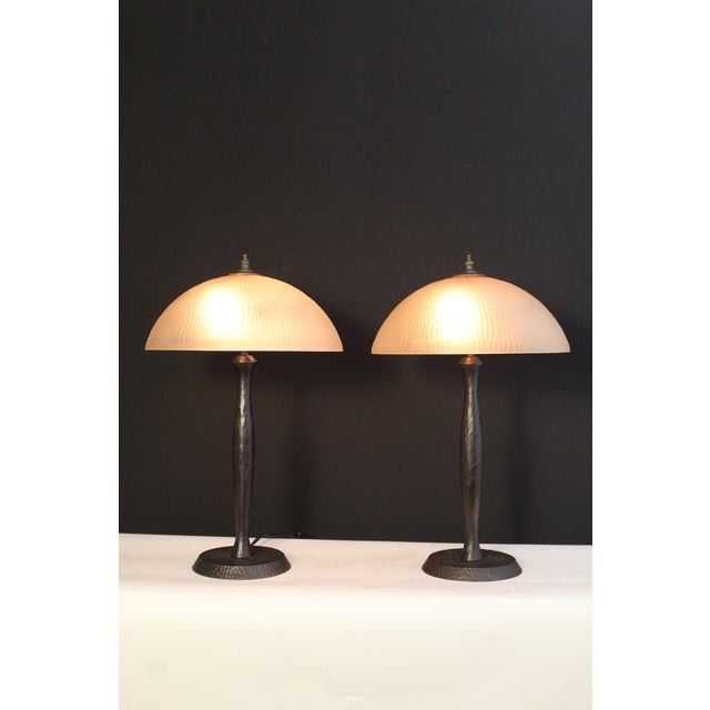 A pair of Oscar Bruno Bach influence lamps. Nice representation of Arts & craft. Hammered cast base with a bronze overlay...