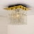 Amazing flush mount chandelier with eight hanging hand blow textured hollow glass prisms mounted on a brass frame. Made by...