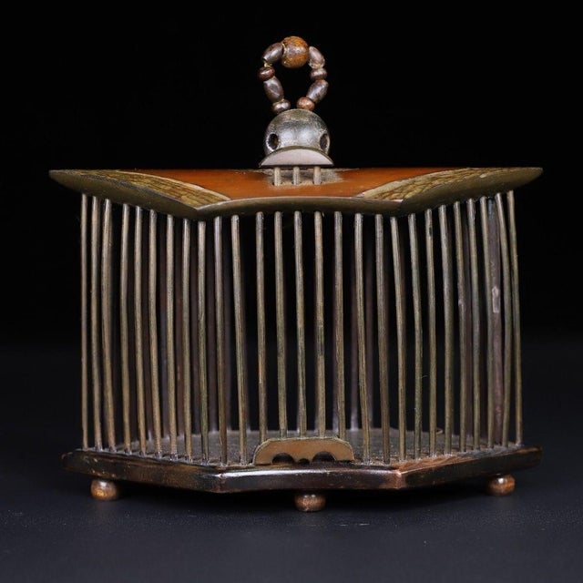 This is a charming and intricately crafted vintage cricket cage (also known as a singing insect cage), traditionally used...