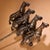 A magnificent bronze sculpture of a traditional Chinese four-horse royal chariot, decorated with delicate gold inlaid...