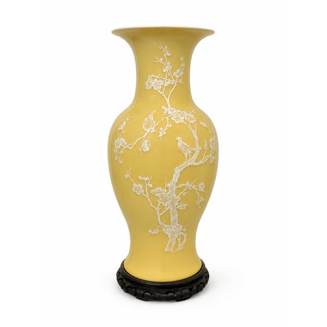 A striking Chinese yellow porcelain vase with a beautifully decorative white raised-relief design of flowering prunus...