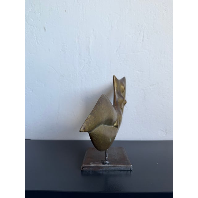 Patinated bronze modernist sculpture of a female torso suspended on a steel base by Domenico Calabrone, Brazil 1980s.