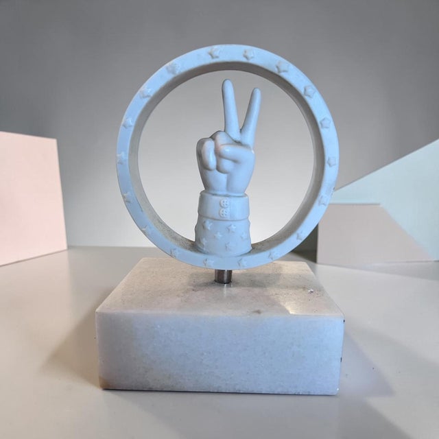 Add a touch of Jonathan Adler’s signature whimsy and modern glamour with this sculptural peace sign objet d’art. Featuring...