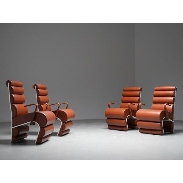 A set of four highly unusual dining chairs from the 1970s, built around a sculptural idea rather than a conventional...