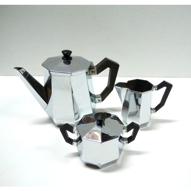 This rare Ottagonale Alessi tea set of 4 pieces,including the tray,are used and is in good vintage condition. Cleaned and...