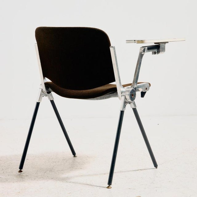 A ‘DSC106’ chair with a writing tablet, designed by Giancarlo Piretti for Anonima Castelli in the 1960s. Its chrome-plated...