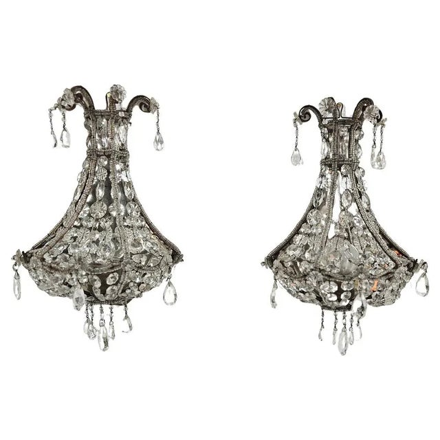 A beautiful pair of wall sconces produced in Italy during the 1940's. The style is romantic rococo with a beautiful...