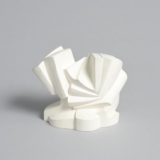 This abstract sculpture in plaster was made by the Belgian artist Jan Keustermans. The sculpture has a rough plaster...